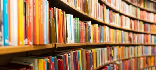 Library with many shelves and books, diminishing perspective and shallow dof